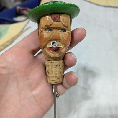 Collection of 4 ANRI Hand Carved Bottle Stoppers