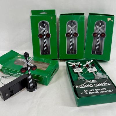 Sale Photo Thumbnail #152: Battery powered railroad crossing signs. Can also be converted to DC (plug-in) power. Look to be for 027 gauge. Near new condition with original boxes. Made in Taiwan.