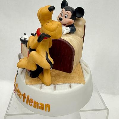 Sale Photo Thumbnail #164: Ceramic figurine of Mickey and Pluto, with Pluto acting as Mickey's butler.  Recreates a scene from a 1941 cartoon.  Very good condition.