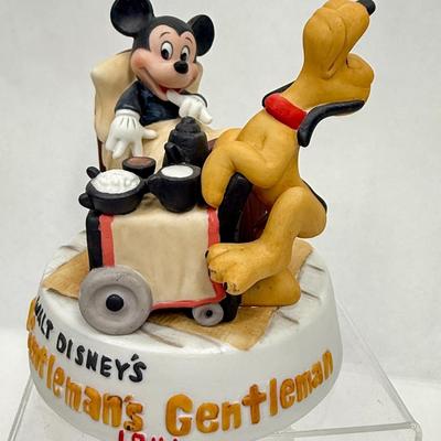 Sale Photo Thumbnail #163: Ceramic figurine of Mickey and Pluto, with Pluto acting as Mickey's butler.  Recreates a scene from a 1941 cartoon.  Very good condition.