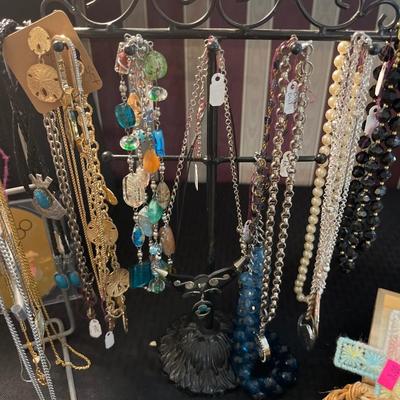 Sale Photo Thumbnail #4: Earrings, Necklaces, thimbles, watches, bracelets & more.

Lights and shelves not included.