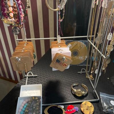 Sale Photo Thumbnail #3: Earrings, Necklaces, thimbles, watches, bracelets & more.

Lights and shelves not included.