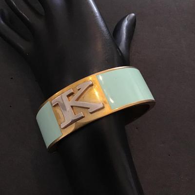 C wonder goldtone bracelet with mint enamel with a K