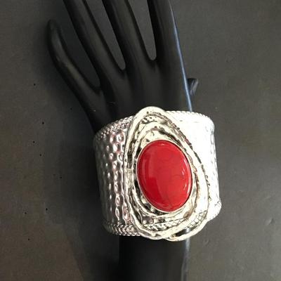 Large silver tone, cuff with red faux stone