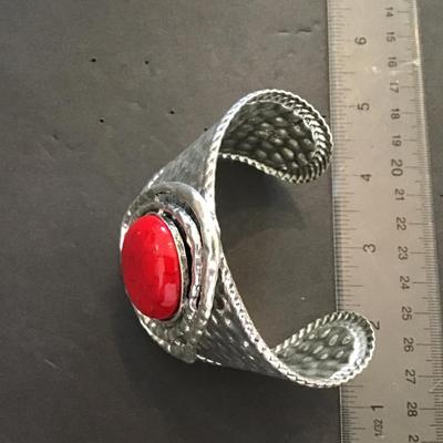 Large silver tone, cuff with red faux stone