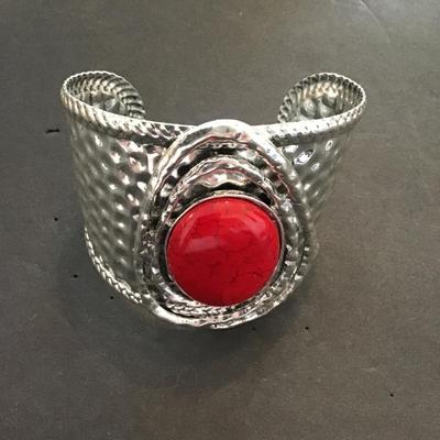 Large silver tone, cuff with red faux stone