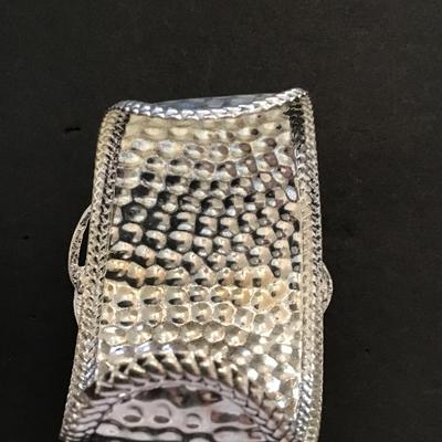 Large silver tone, cuff with red faux stone