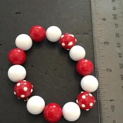 Red and white plastic bead stretch bracelet
