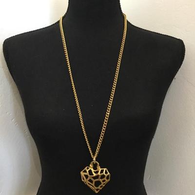 Very nice gold tone, thick chunky chain necklace, and a heart lattice pendant