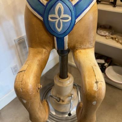 Sale Photo Thumbnail #3: on a working Barber Chair base. 
Horse can be raised and lowered by pumping one foot pedal for up and pushing and holding the other pedal.  Very heavy item.
Dimensions: Min height is 53.5" x approx 52" wide x 24" deep base,
Min height 38" tall is the seat