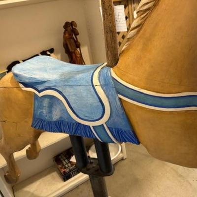 Sale Photo Thumbnail #6: on a working Barber Chair base. 
Horse can be raised and lowered by pumping one foot pedal for up and pushing and holding the other pedal.  Very heavy item.
Dimensions: Min height is 53.5" x approx 52" wide x 24" deep base,
Min height 38" tall is the seat