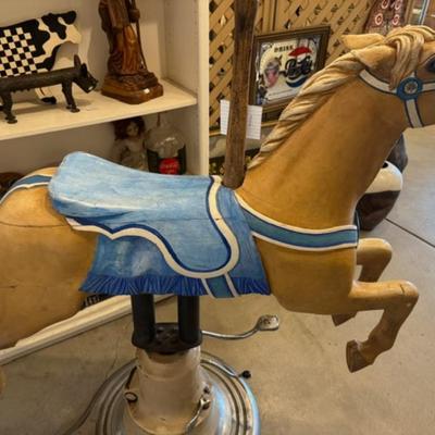 Sale Photo Thumbnail #27: on a working Barber Chair base. 
Horse can be raised and lowered by pumping one foot pedal for up and pushing and holding the other pedal.  Very heavy item.
Dimensions: Min height is 53.5" x approx 52" wide x 24" deep base,
Min height 38" tall is the seat