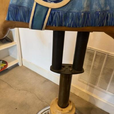 Sale Photo Thumbnail #18: on a working Barber Chair base. 
Horse can be raised and lowered by pumping one foot pedal for up and pushing and holding the other pedal.  Very heavy item.
Dimensions: Min height is 53.5" x approx 52" wide x 24" deep base,
Min height 38" tall is the seat