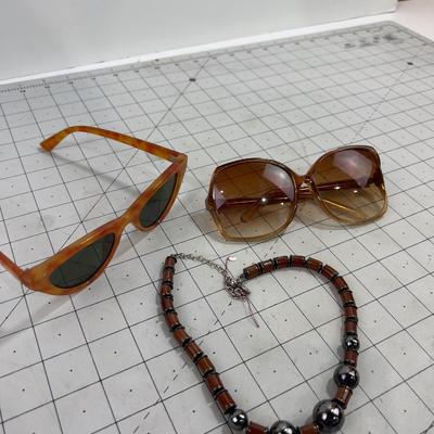 2 pair of Sunglasses and a Necklace