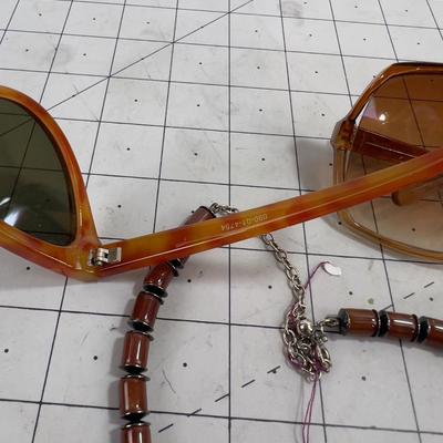 2 pair of Sunglasses and a Necklace