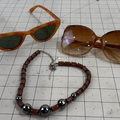 2 pair of Sunglasses and a Necklace