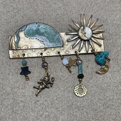 Geometric landscape pin and green patina brass