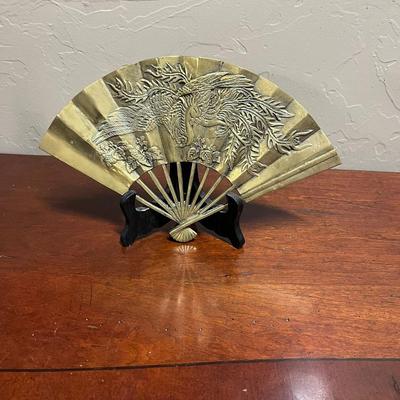 Brass Fan with Figure of Phoenix stands on display easle