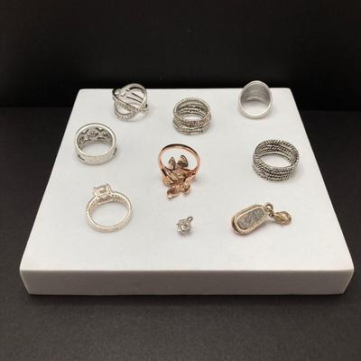 LOT 58: Collection of Fashion Rings with Ring Holder and Charms