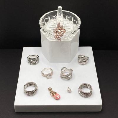 LOT 58: Collection of Fashion Rings with Ring Holder and Charms