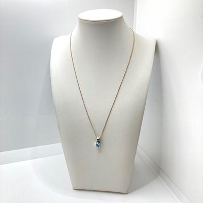LOT 65: Sterling Silver Jewelry - Blue Stone Pendant Necklace and Dangle Earrings