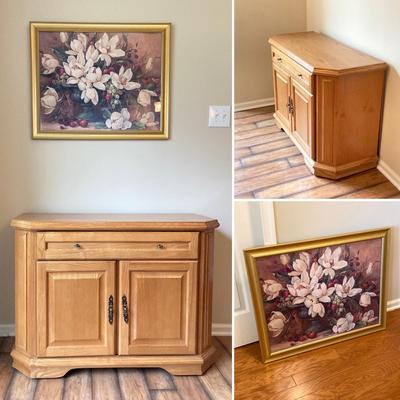 LOT 75: Wooden Storage Cabinet with Framed Magnolia Floral Artwork by Barbara Mock