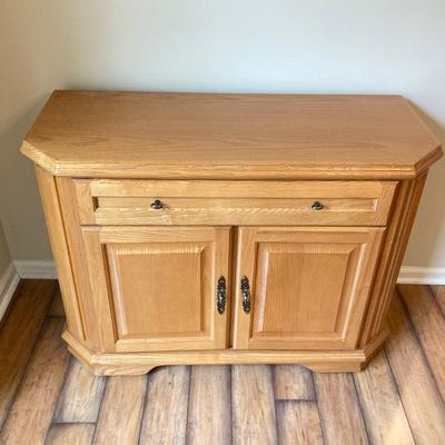 LOT 75: Wooden Storage Cabinet with Framed Magnolia Floral Artwork by Barbara Mock