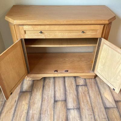 LOT 75: Wooden Storage Cabinet with Framed Magnolia Floral Artwork by Barbara Mock