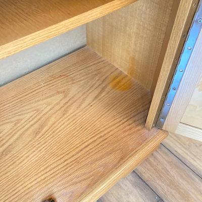 LOT 75: Wooden Storage Cabinet with Framed Magnolia Floral Artwork by Barbara Mock