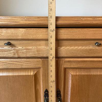 LOT 75: Wooden Storage Cabinet with Framed Magnolia Floral Artwork by Barbara Mock