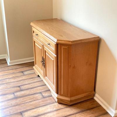 LOT 75: Wooden Storage Cabinet with Framed Magnolia Floral Artwork by Barbara Mock