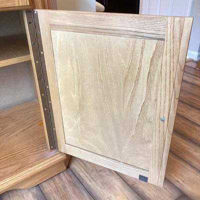 LOT 75: Wooden Storage Cabinet with Framed Magnolia Floral Artwork by Barbara Mock