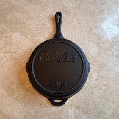 LOT 87: Cast Iron: Cabela's 10" Skillet, Unmarked #5 Skillet & a 9" Meat Press