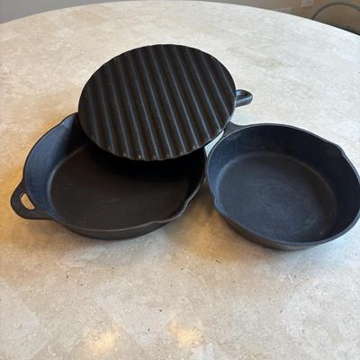 LOT 87: Cast Iron: Cabela's 10" Skillet, Unmarked #5 Skillet & a 9" Meat Press