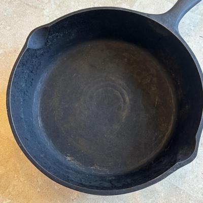 LOT 87: Cast Iron: Cabela's 10" Skillet, Unmarked #5 Skillet & a 9" Meat Press