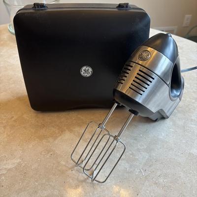 LOT 88: Kitchen Essentials: GE Hand Mixer, Rolling Pin, Pyrex Pie Plates, Glass Mixing Bowl along with Vintage Kitchen Utensils