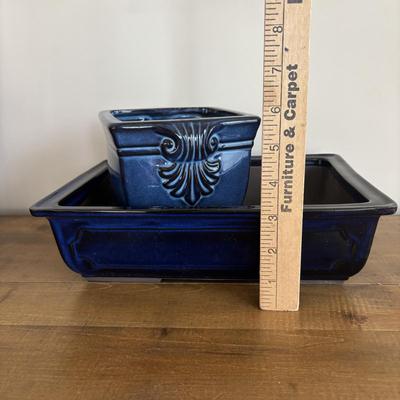 LOT 104: Large Blue Wicker Basket w/Ceramic Handles, LBK Berry Design Pitcher, Blue/White Candlesticks, Metal Flower Vase, Blue Glaze...