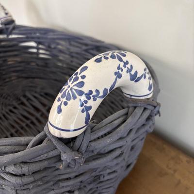 LOT 104: Large Blue Wicker Basket w/Ceramic Handles, LBK Berry Design Pitcher, Blue/White Candlesticks, Metal Flower Vase, Blue Glaze...