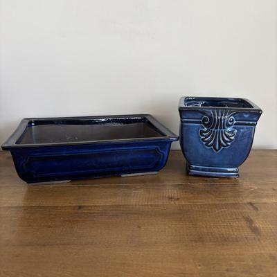 LOT 104: Large Blue Wicker Basket w/Ceramic Handles, LBK Berry Design Pitcher, Blue/White Candlesticks, Metal Flower Vase, Blue Glaze...