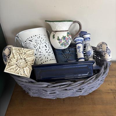 LOT 104: Large Blue Wicker Basket w/Ceramic Handles, LBK Berry Design Pitcher, Blue/White Candlesticks, Metal Flower Vase, Blue Glaze...