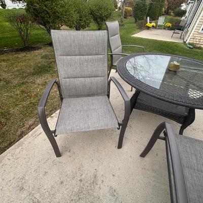 LOT 105: Stylewell Outdoor Patio Chairs along with a Round Wicker & Glass Patio Table