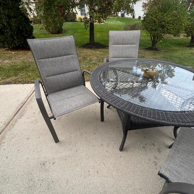 LOT 105: Stylewell Outdoor Patio Chairs along with a Round Wicker & Glass Patio Table