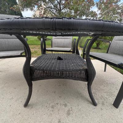 LOT 105: Stylewell Outdoor Patio Chairs along with a Round Wicker & Glass Patio Table
