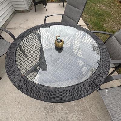 LOT 105: Stylewell Outdoor Patio Chairs along with a Round Wicker & Glass Patio Table
