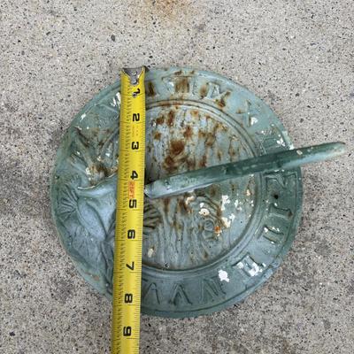 LOT 107: Cast Iron Sundial and Resin Cherub Reading a Book Garden Statue