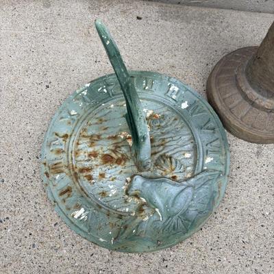 LOT 107: Cast Iron Sundial and Resin Cherub Reading a Book Garden Statue