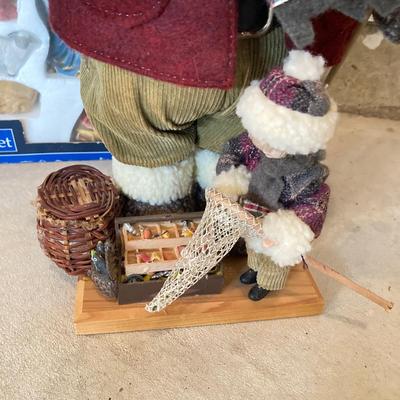 LOT 144: Collection of Christmas / Holiday Decor - Camo Snowman, Mooseltoe Season, Fishing Bear, Lighted Wreath, Nativity Scene and More