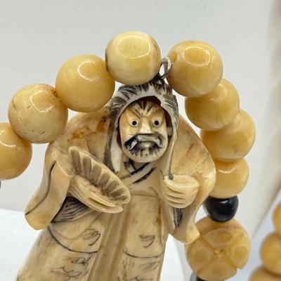 LOT 44J: Japanese Netsuke on Long Prayer Bead Necklace - Laughing / Angry Buddha Toggle Face