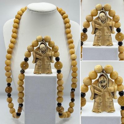 LOT 44J: Japanese Netsuke on Long Prayer Bead Necklace - Laughing / Angry Buddha Toggle Face