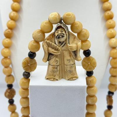 LOT 44J: Japanese Netsuke on Long Prayer Bead Necklace - Laughing / Angry Buddha Toggle Face